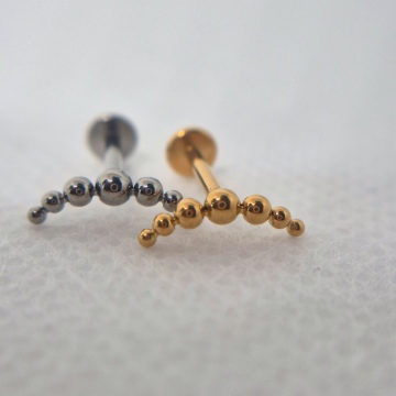 Curved balls labret (gold)